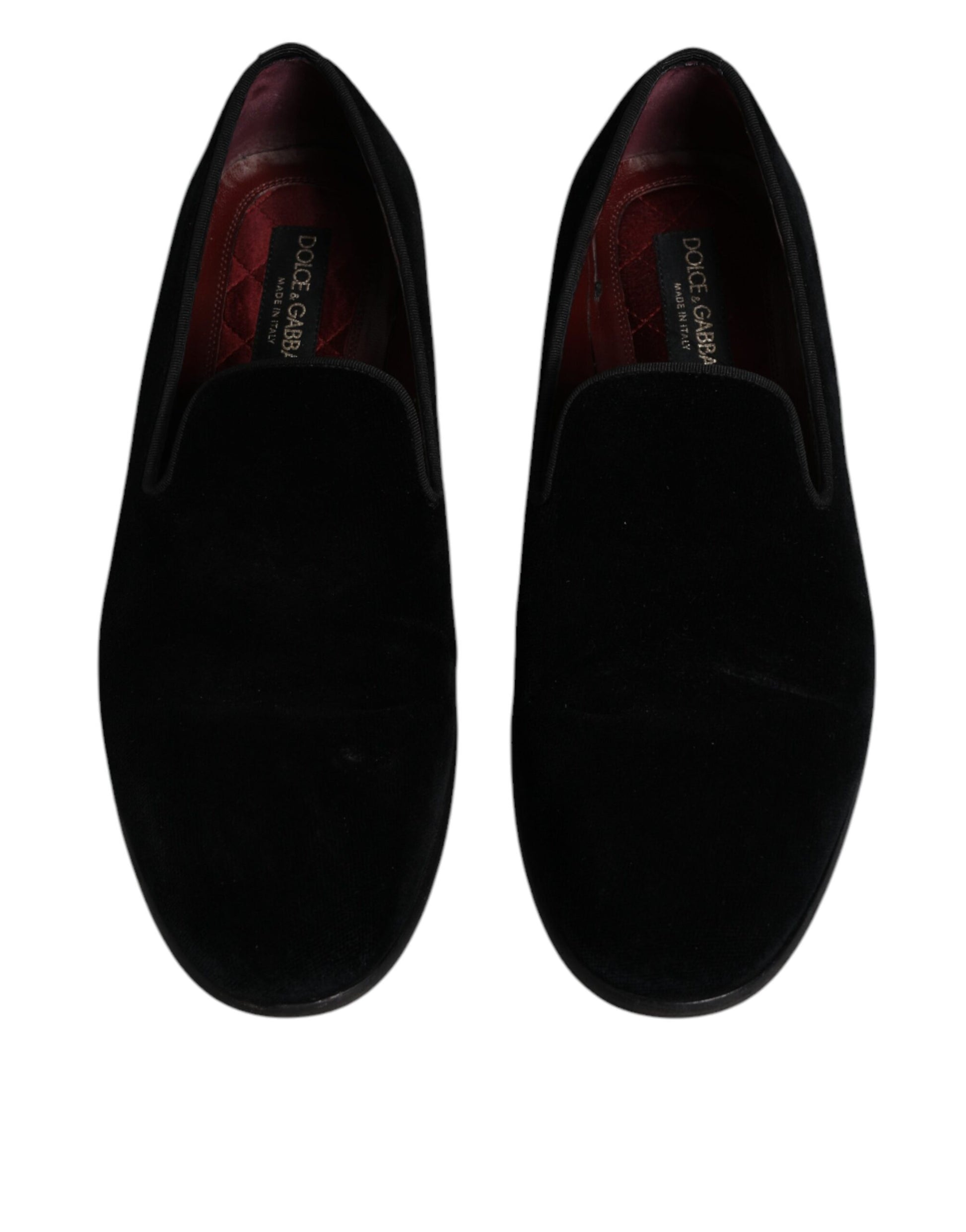 Pair of black velvet loafers with red trim, featuring the Dolce & Gabbana logo