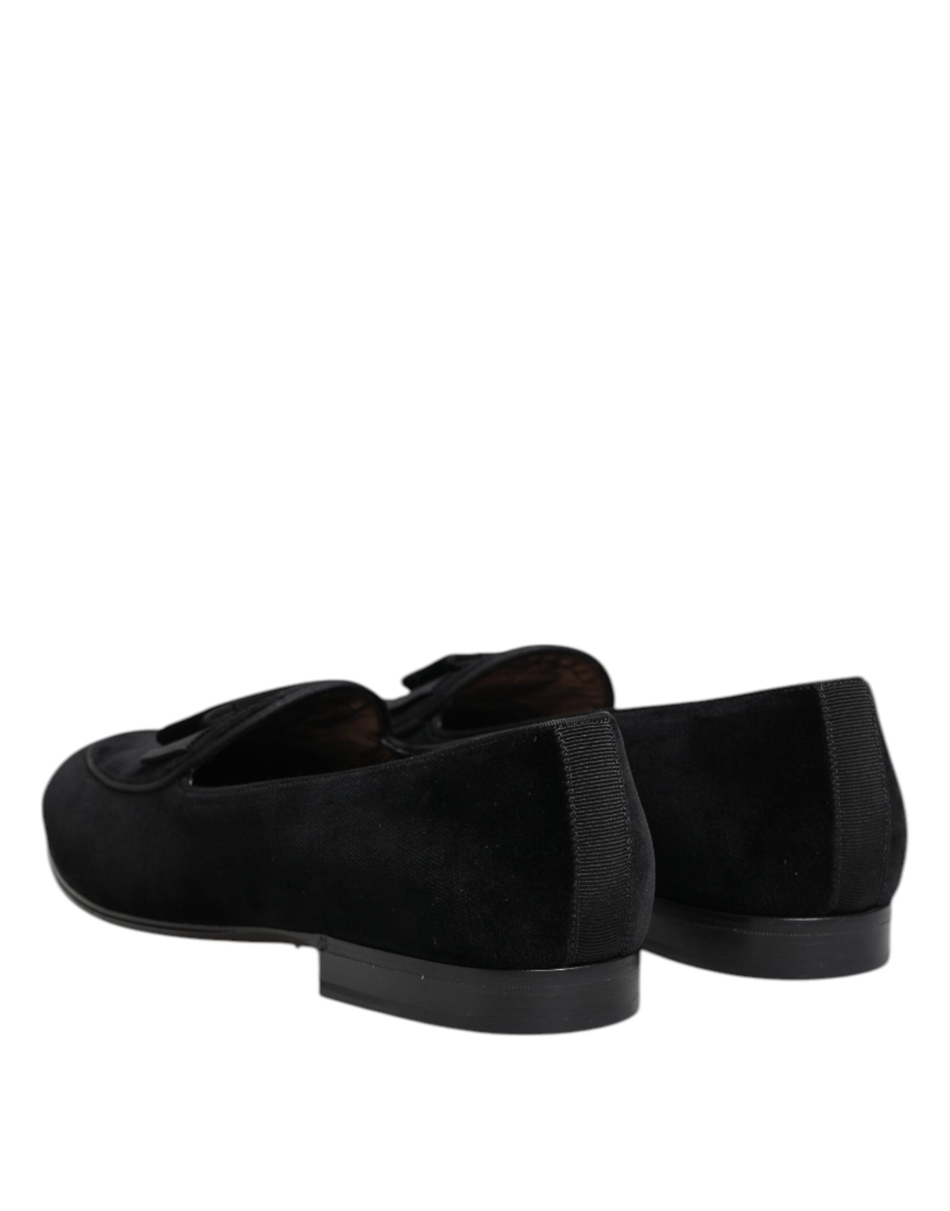 Pair of black velvet loafers with gold buckle detailing, designed for formal men's dress shoes