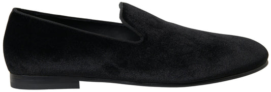 Pair of black velvet loafers with elastic panels and a low heel