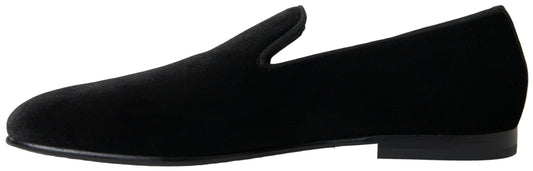 Pair of black shoes with laces and a small heel