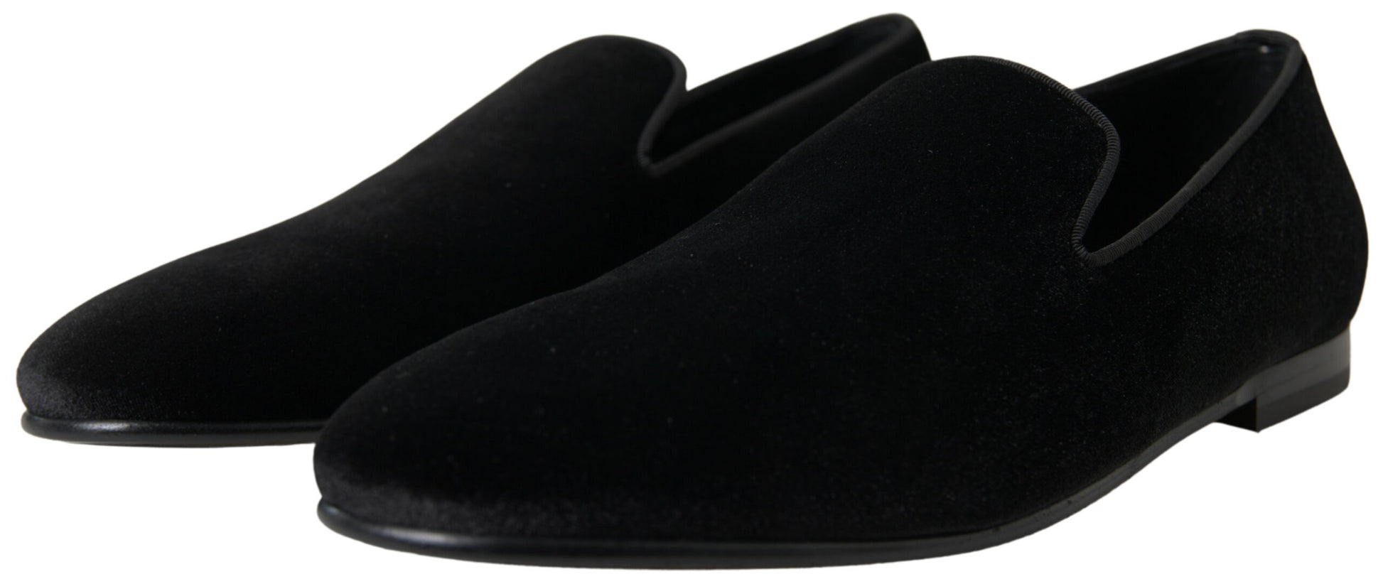 Pair of black velvet loafers with elastic panels and a pointed toe design