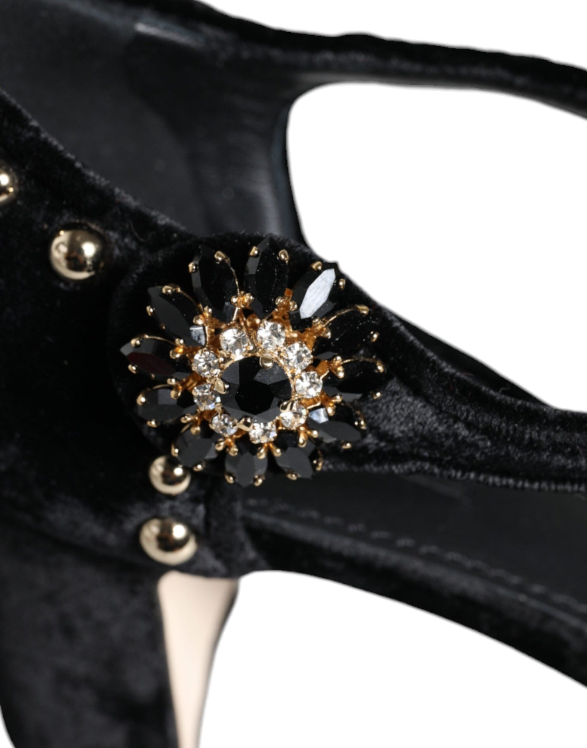 Black shoe with gold embellishment on toe