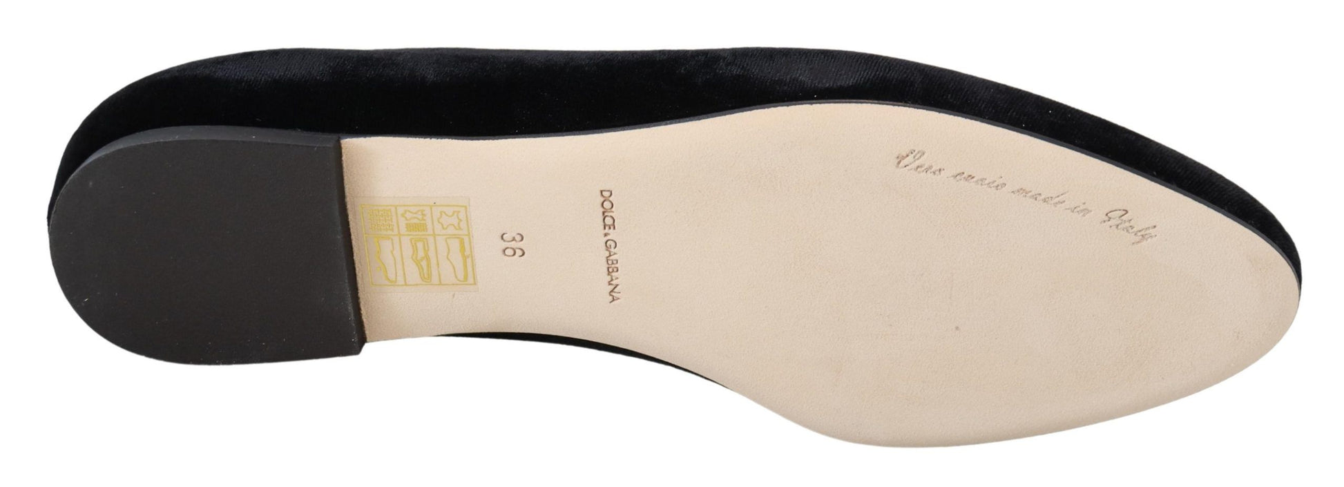 Pair of black and white sneakers with a yellow tag on the tongue