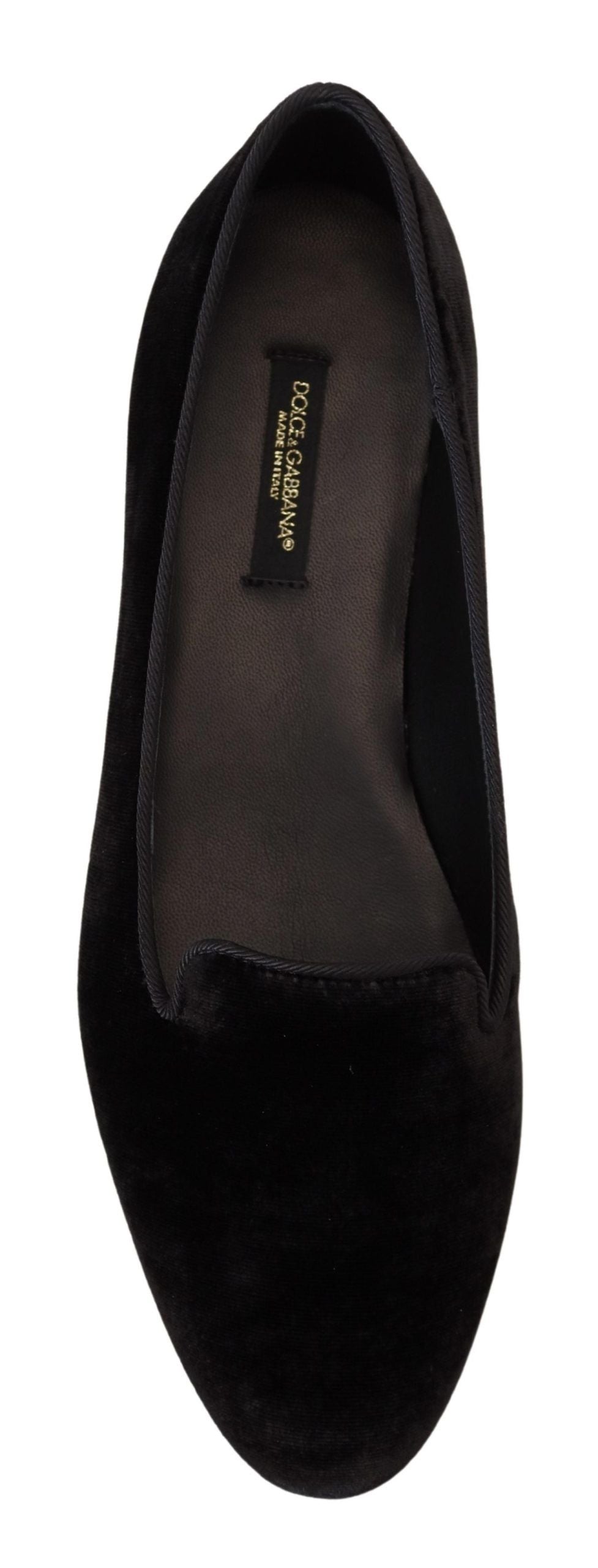 Pair of black velvet loafers with gold label on side
