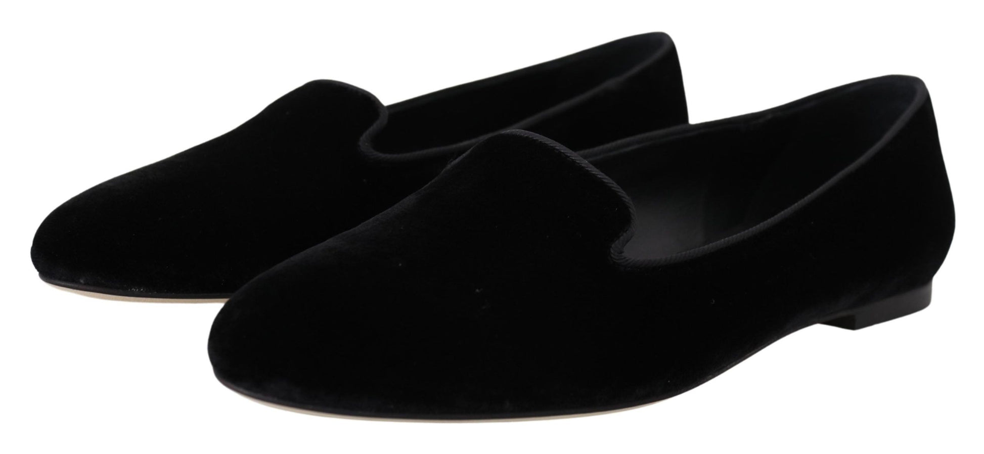 Pair of black velvet loafers with pointed toe and elastic panel on side