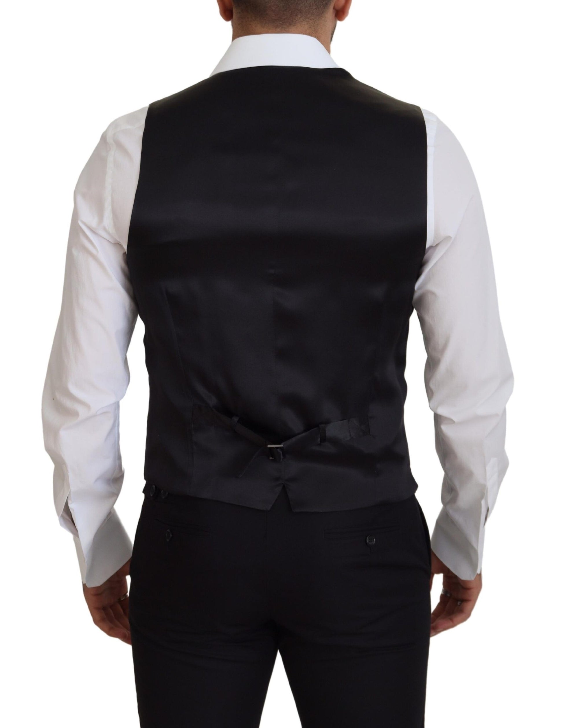 A black vest with a white shirt underneath, part of formal wear