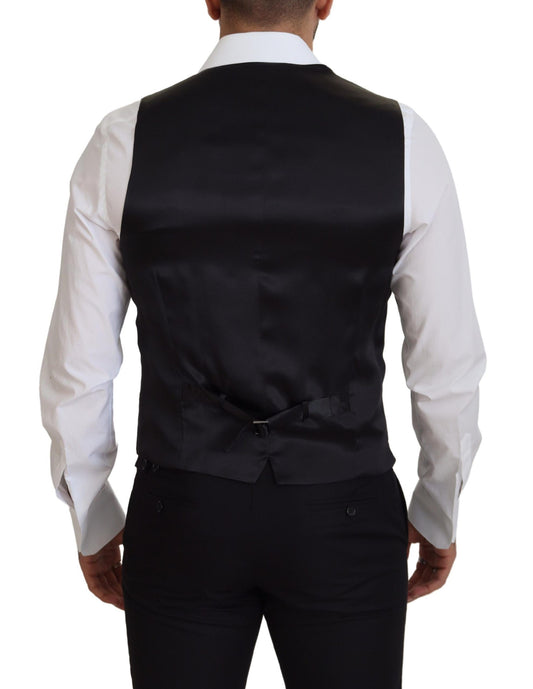 A black vest with a white shirt underneath, part of formal wear