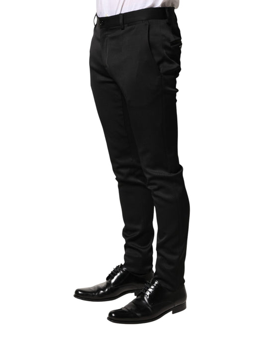 A pair of black trousers with a viscose material. They are designed for formal wear and feature a slim fit