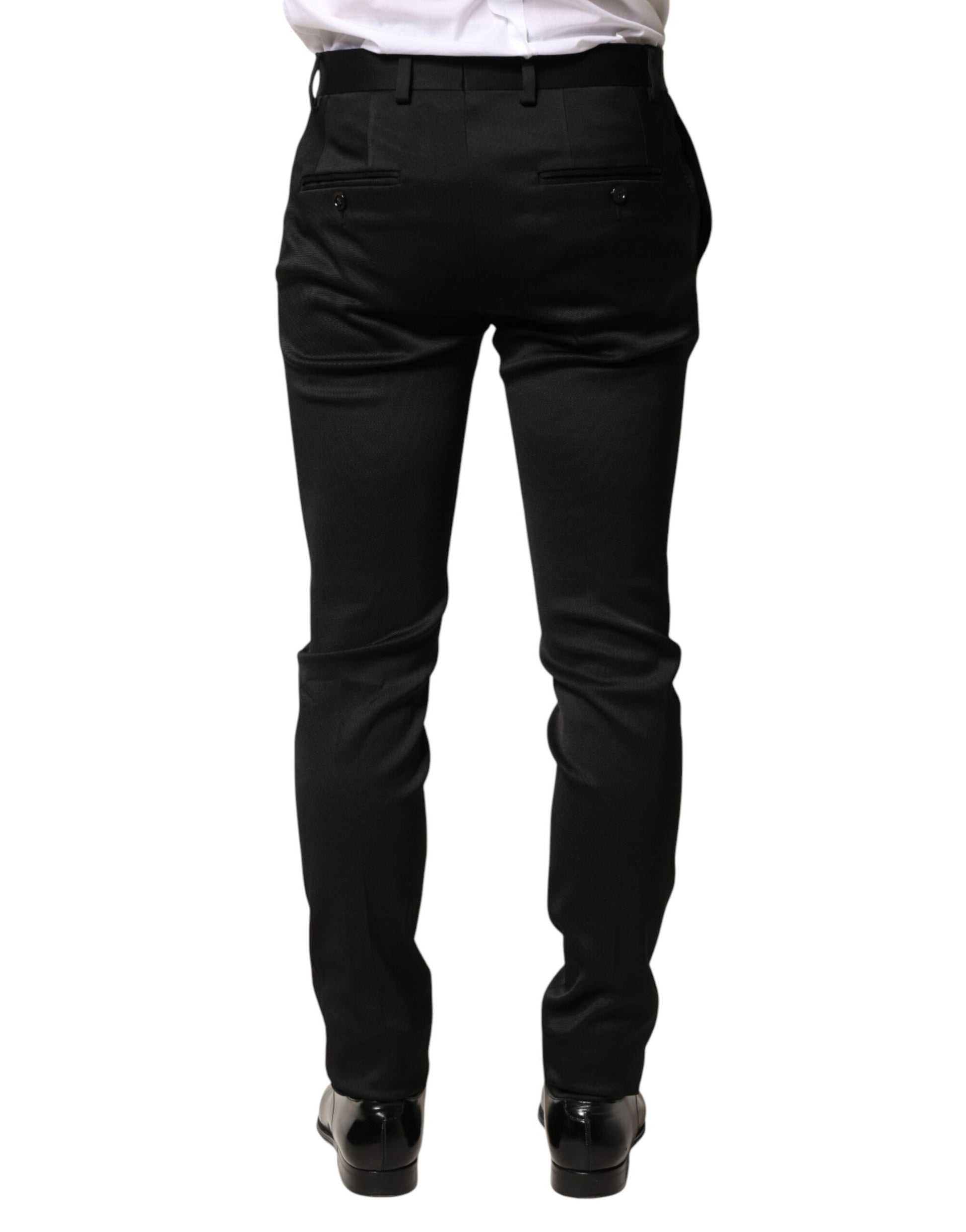 A pair of black trousers made from viscose fabric, designed for formal men's wear