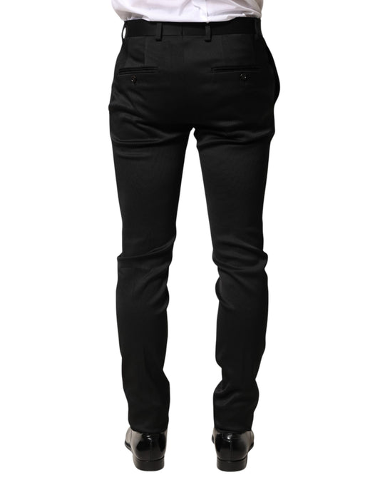 A pair of black trousers made from viscose fabric, designed for formal men's wear