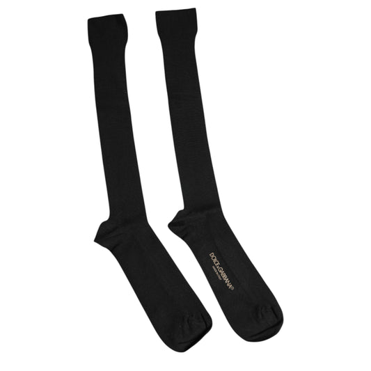 Two black socks on white background