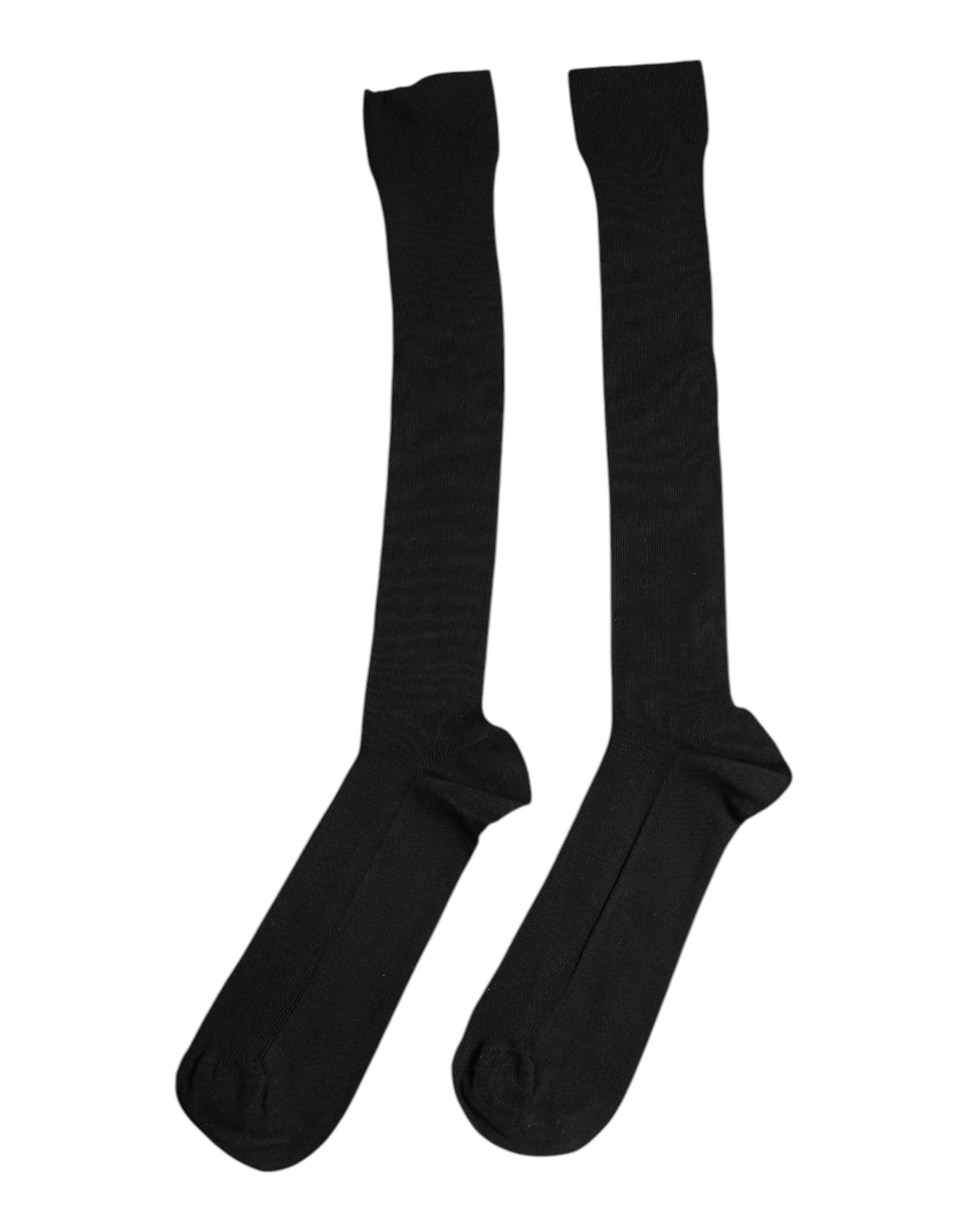 Two black socks on a white background