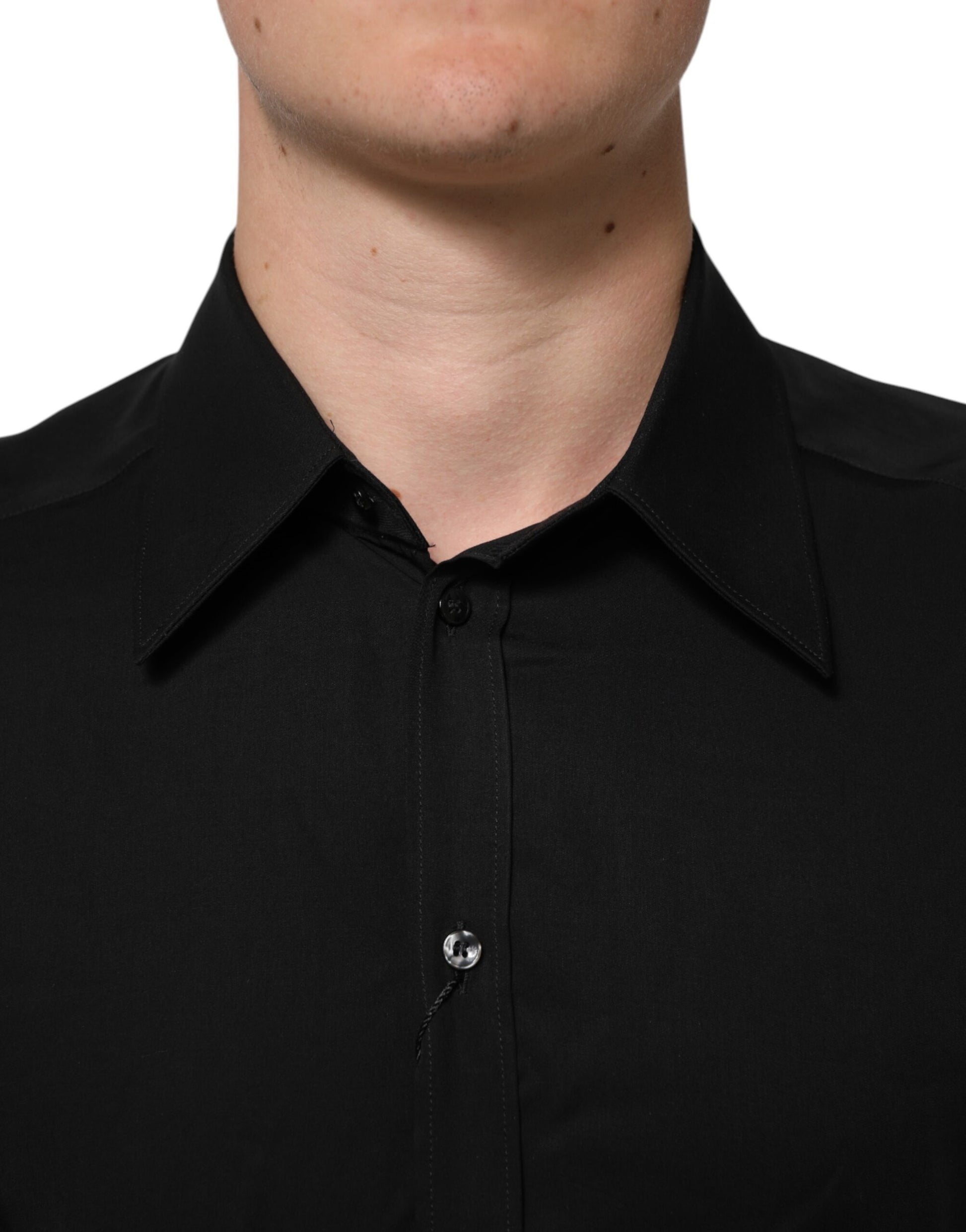 A black viscose long sleeve formal dress shirt with a collar and buttoned front