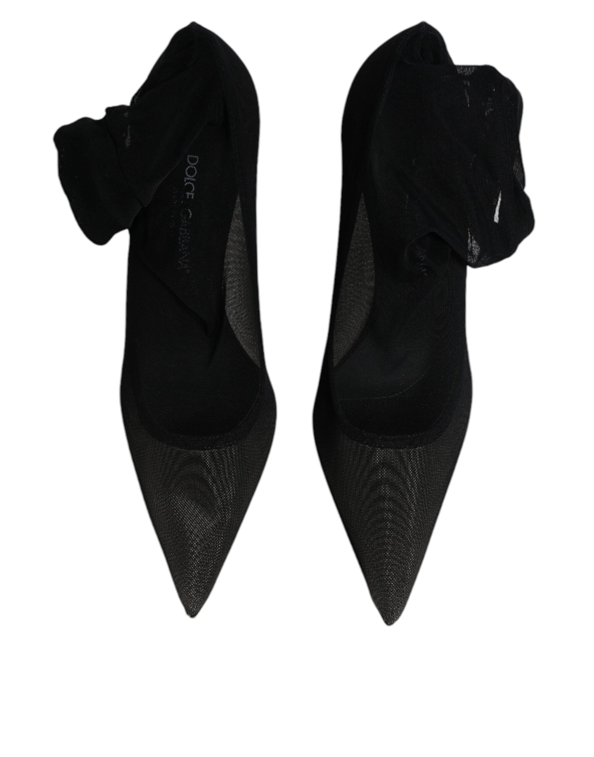 Pair of black high heel shoes with glittery texture