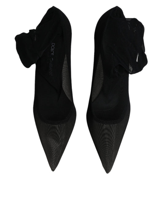Pair of black high heel shoes with glittery texture