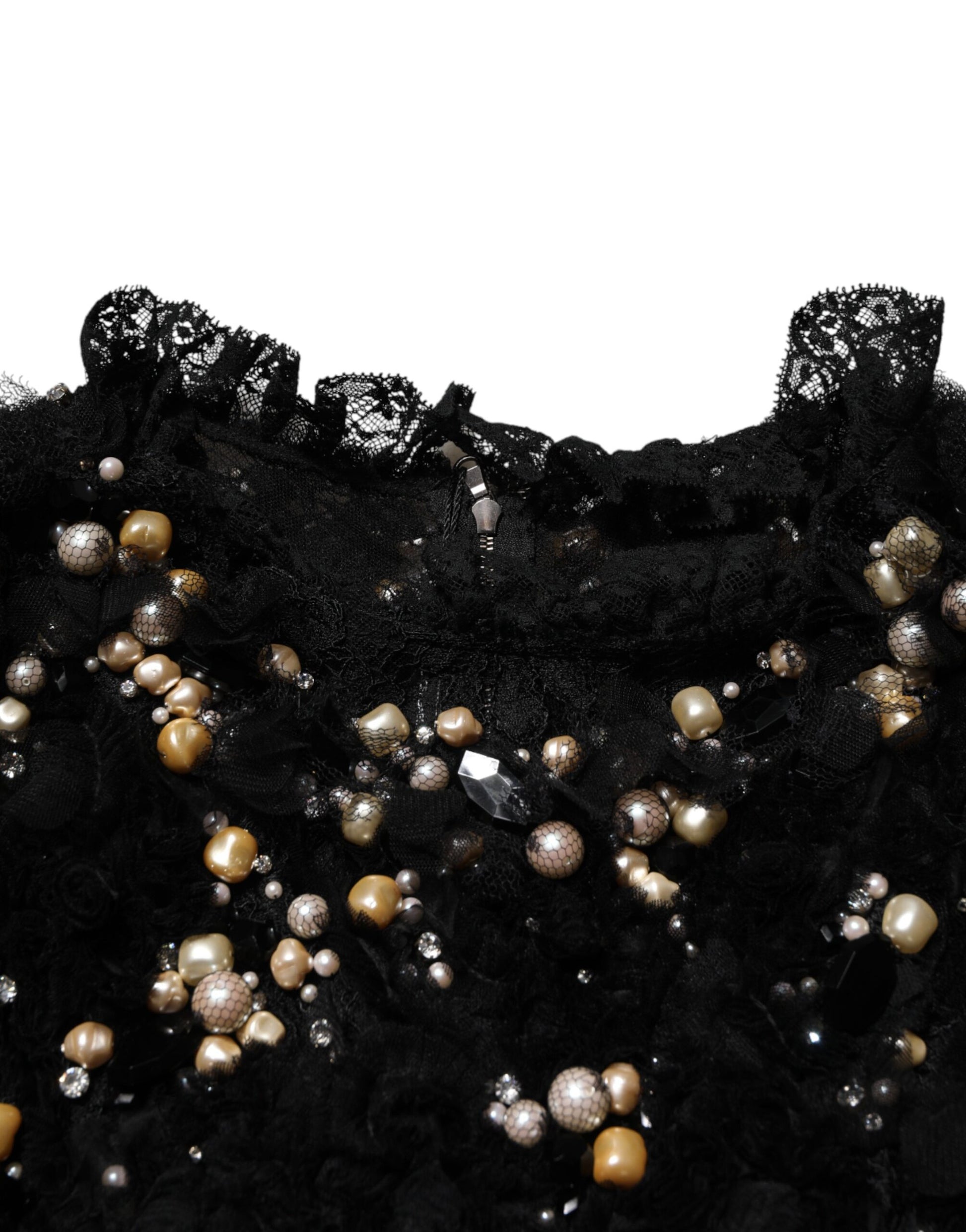 A black dress with pearl embellishments and a lace neckline