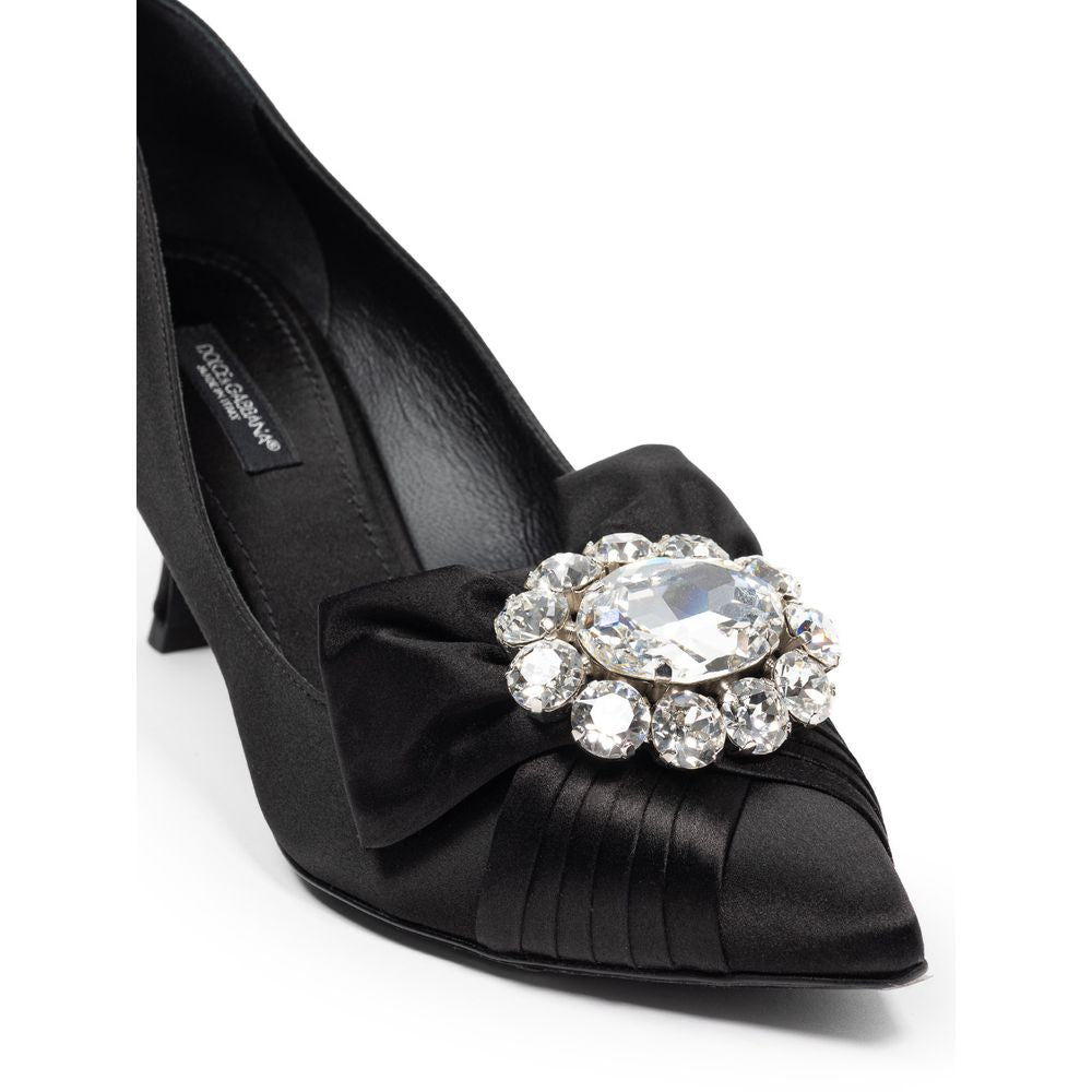 Black shoe with a large sparkling bow on top