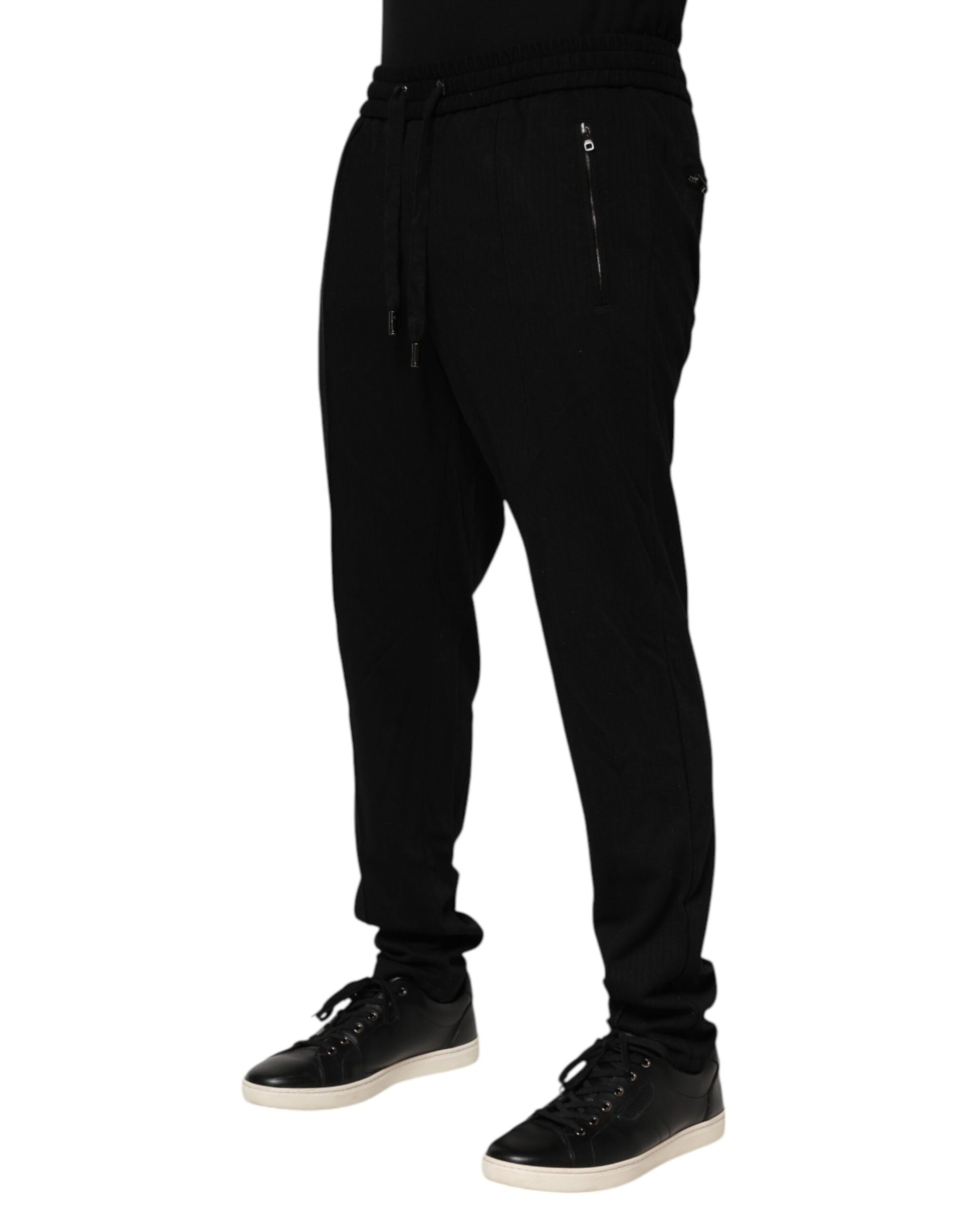 Black sweatpants with zippered pockets on legs