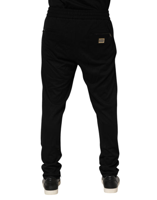 Pair of black pants with a zippered front pocket
