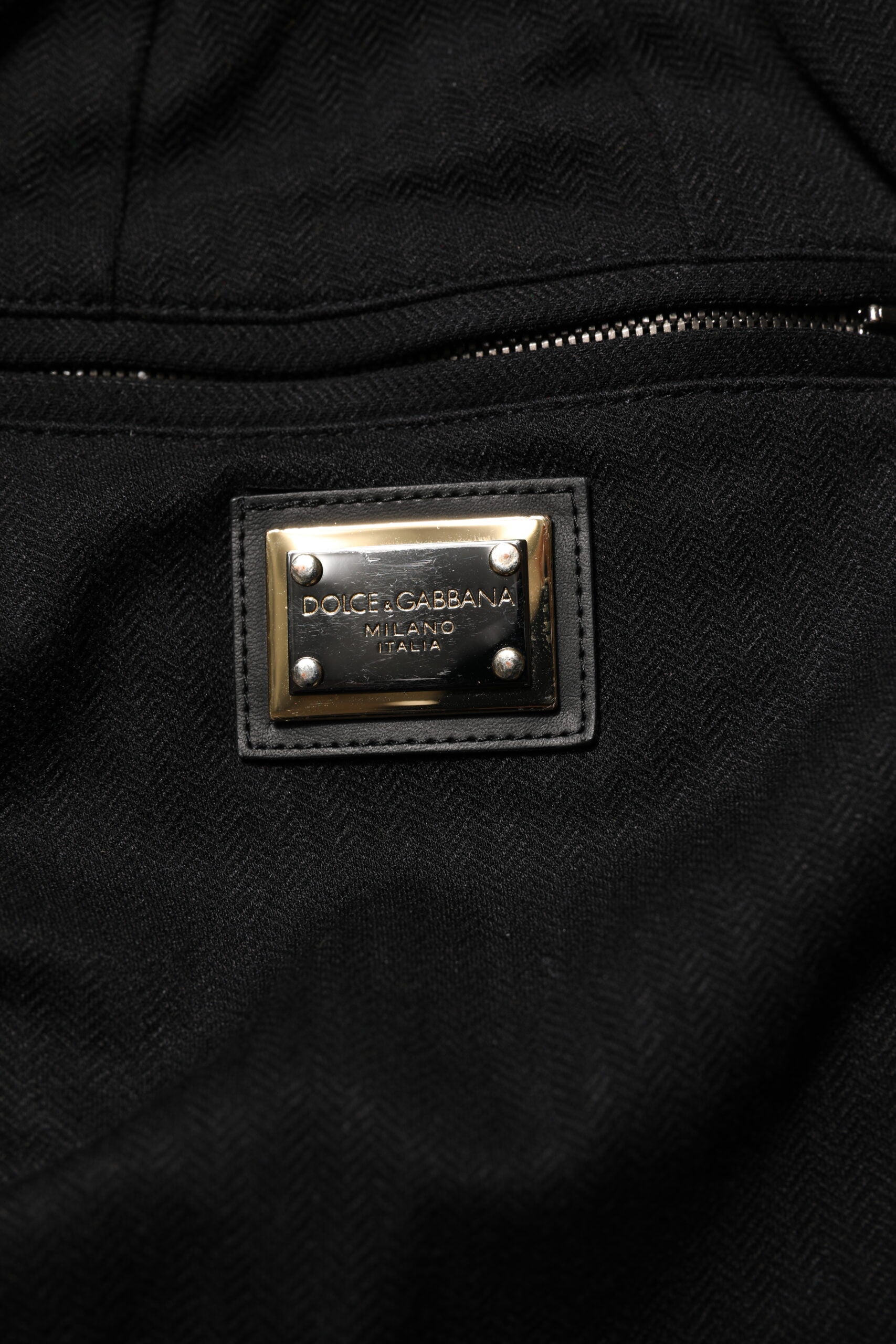 Black leather jacket with zippered front pocket