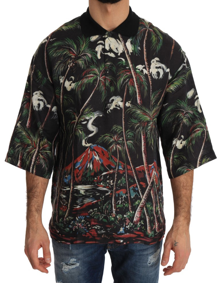 Man wearing a Hawaiian shirt with palm trees and volcanoes