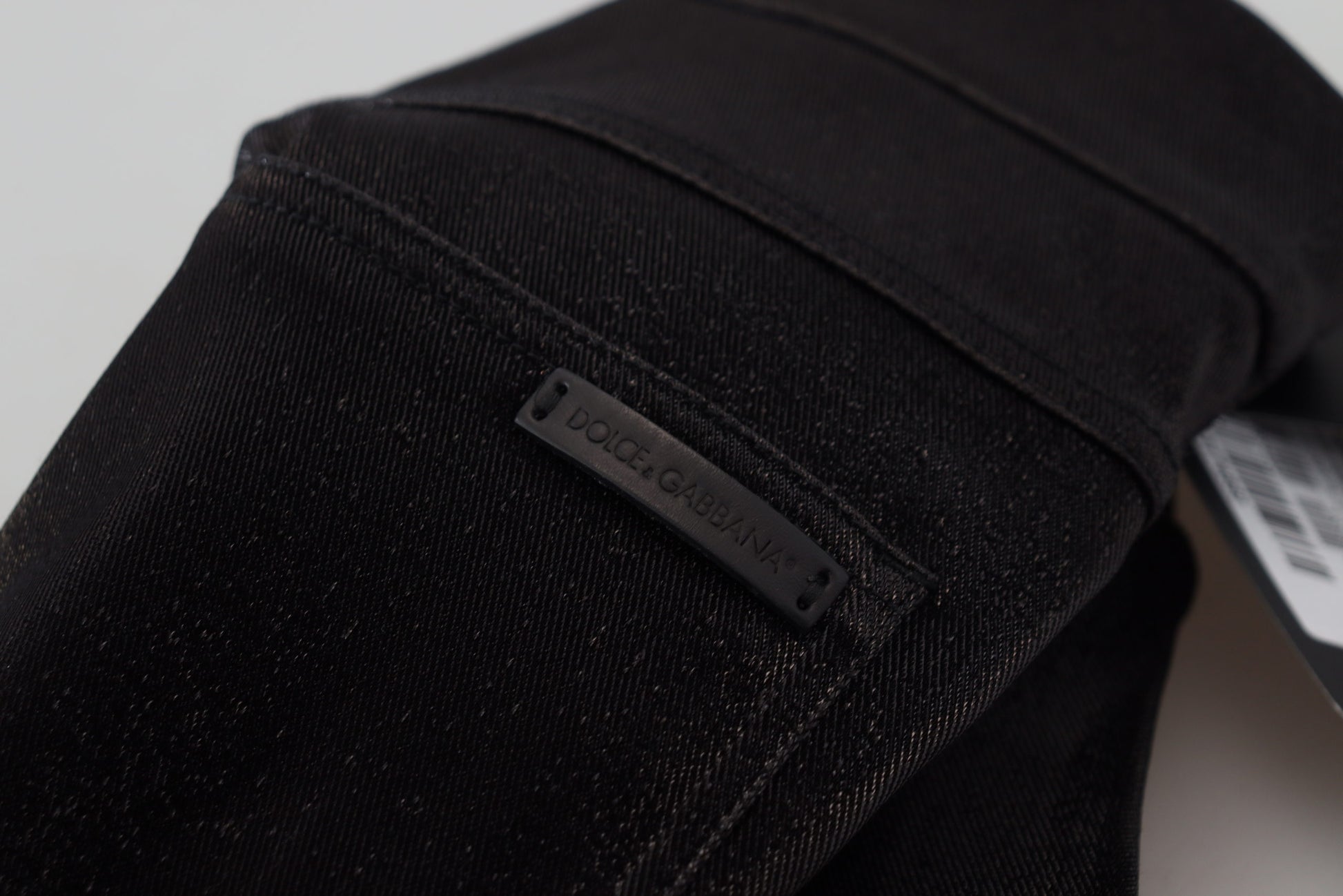 Black jeans with a label on the waistband