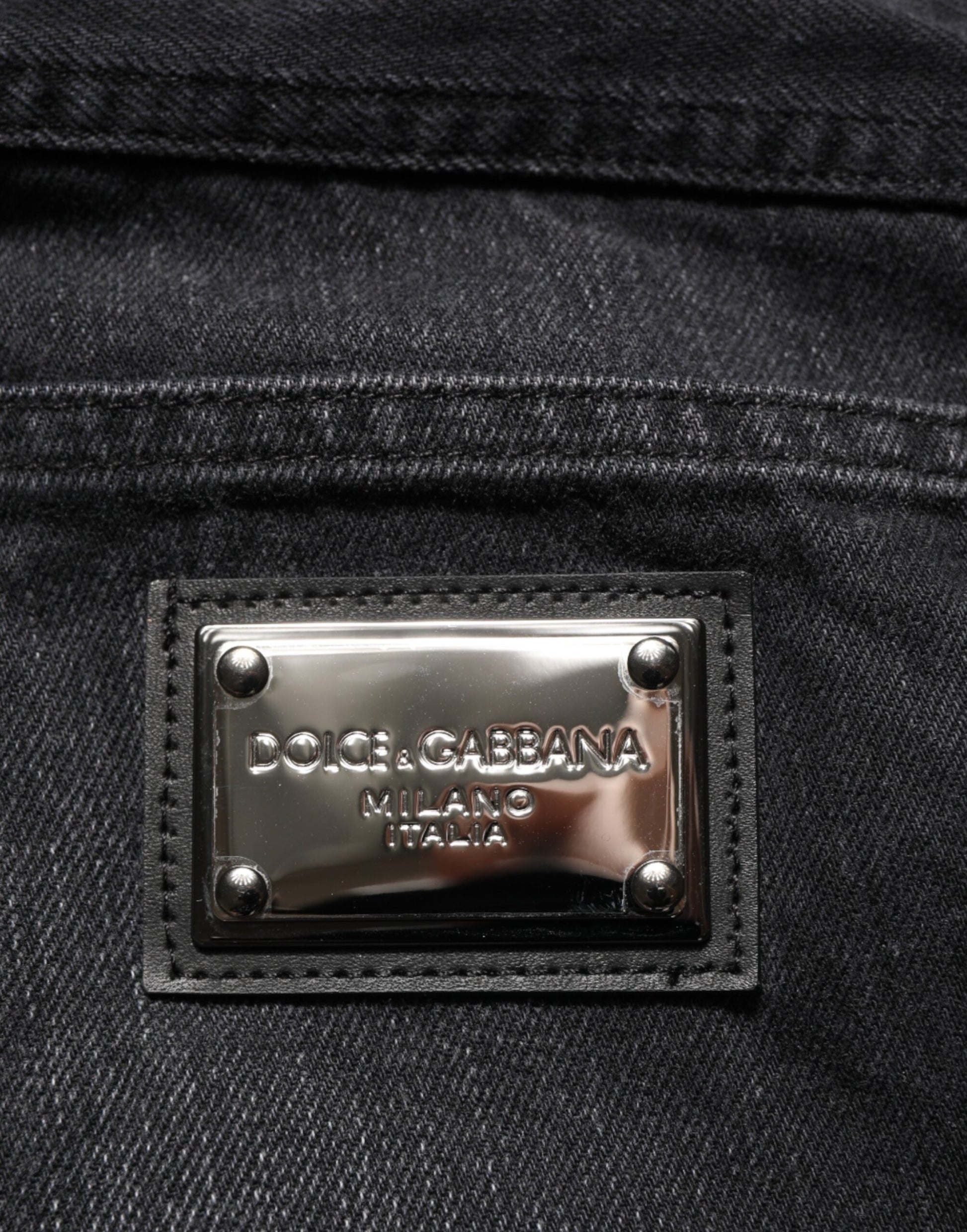 Silver branded label on jeans