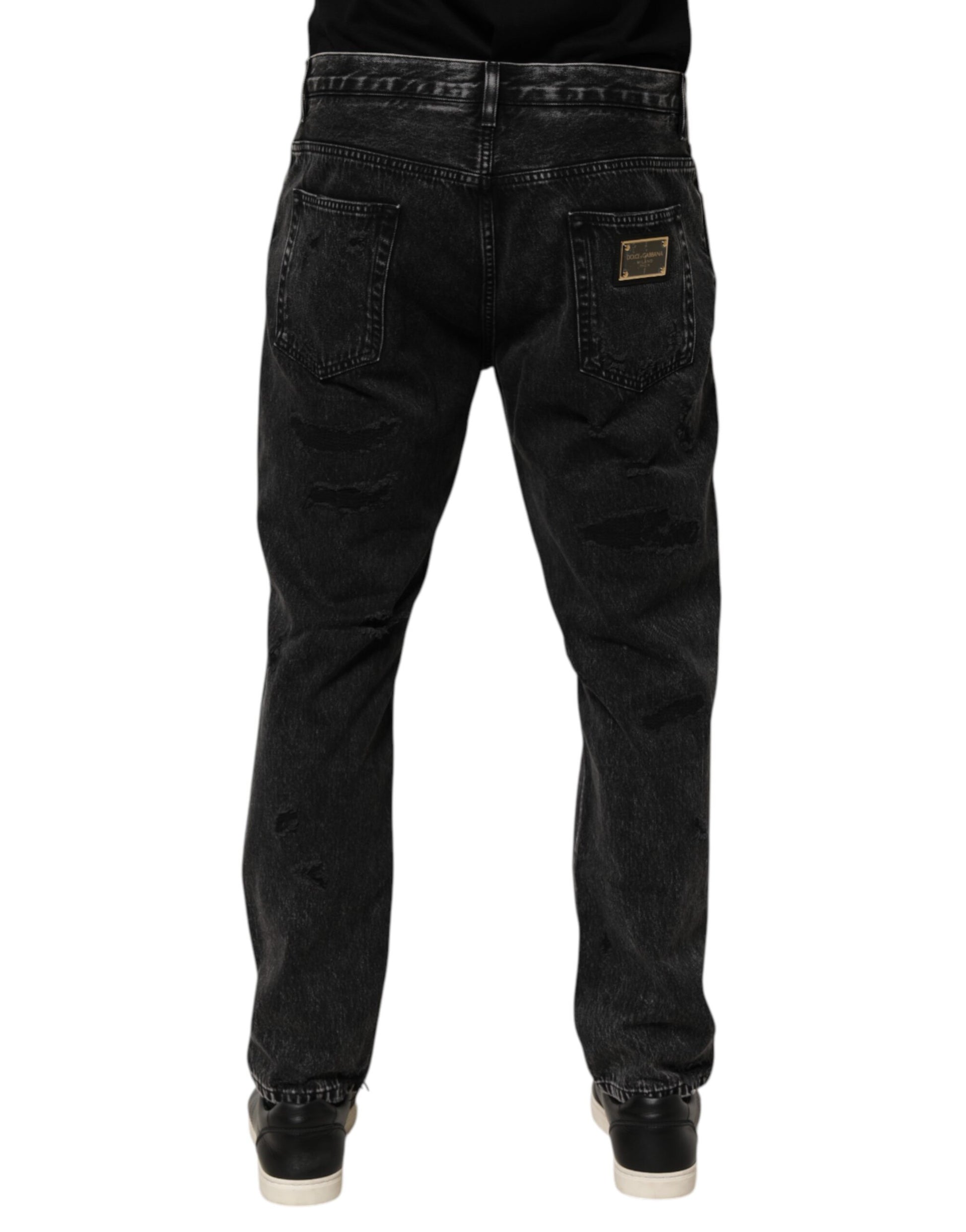 Pair of dark blue jeans with zippered pockets on front