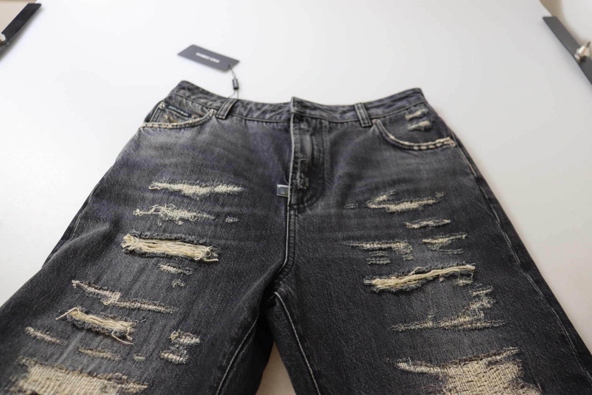 Pair of distressed jeans on display