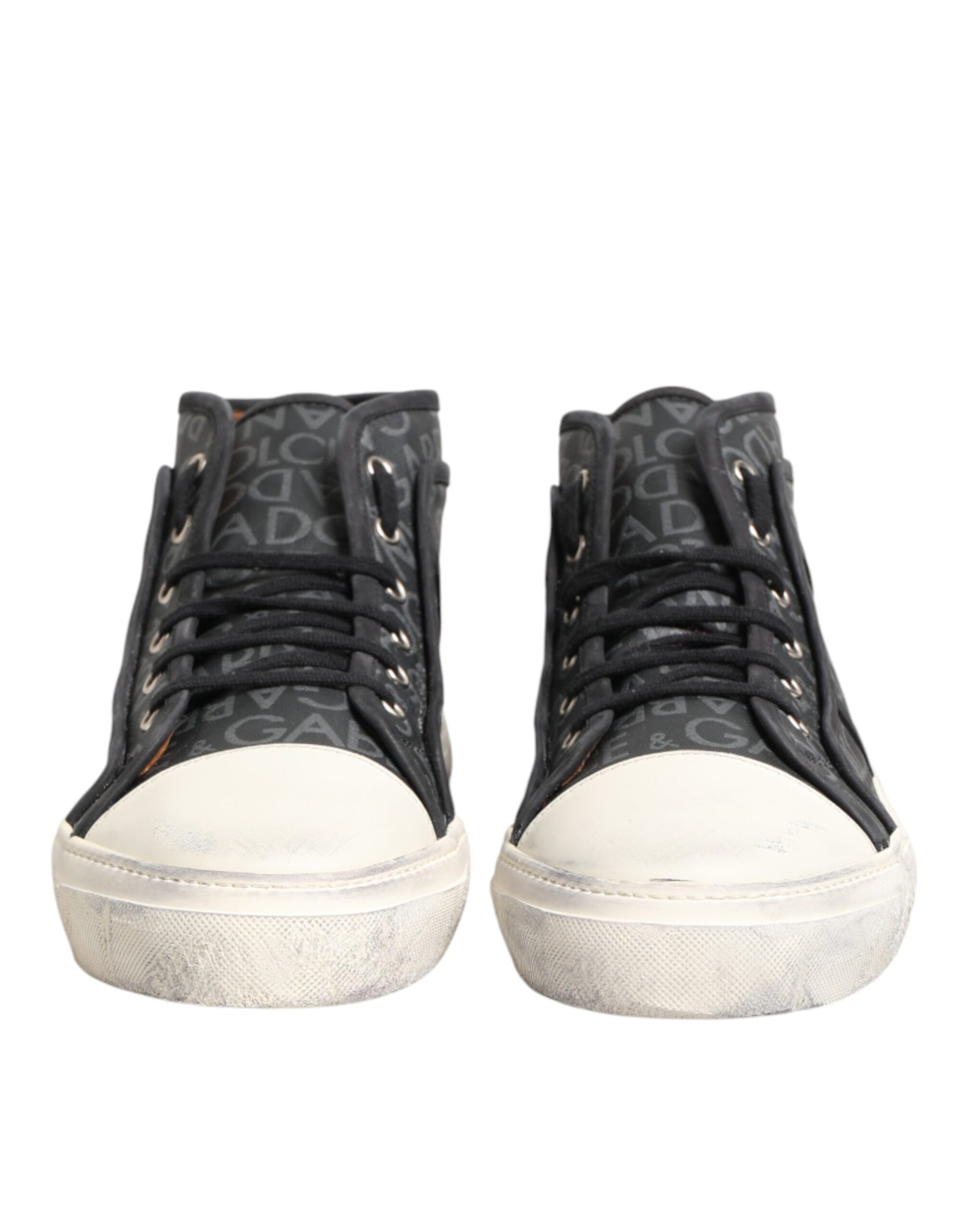 Pair of black sneakers with white soles