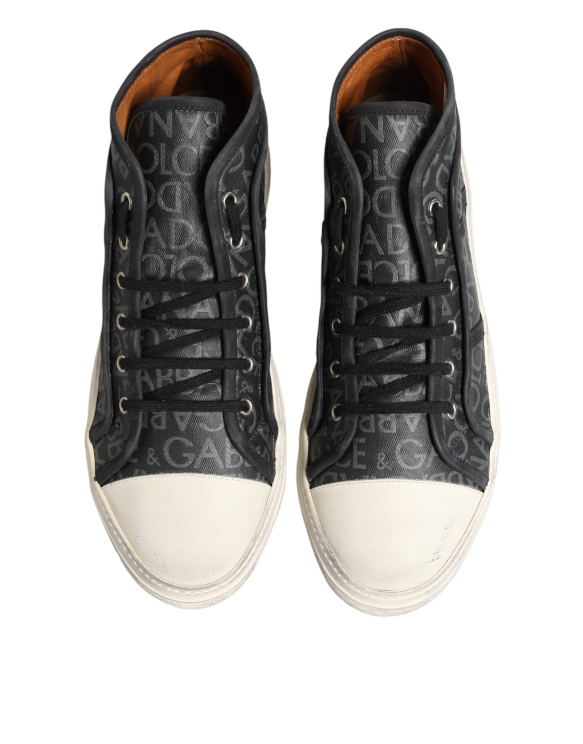 Pair of black sneakers with white soles