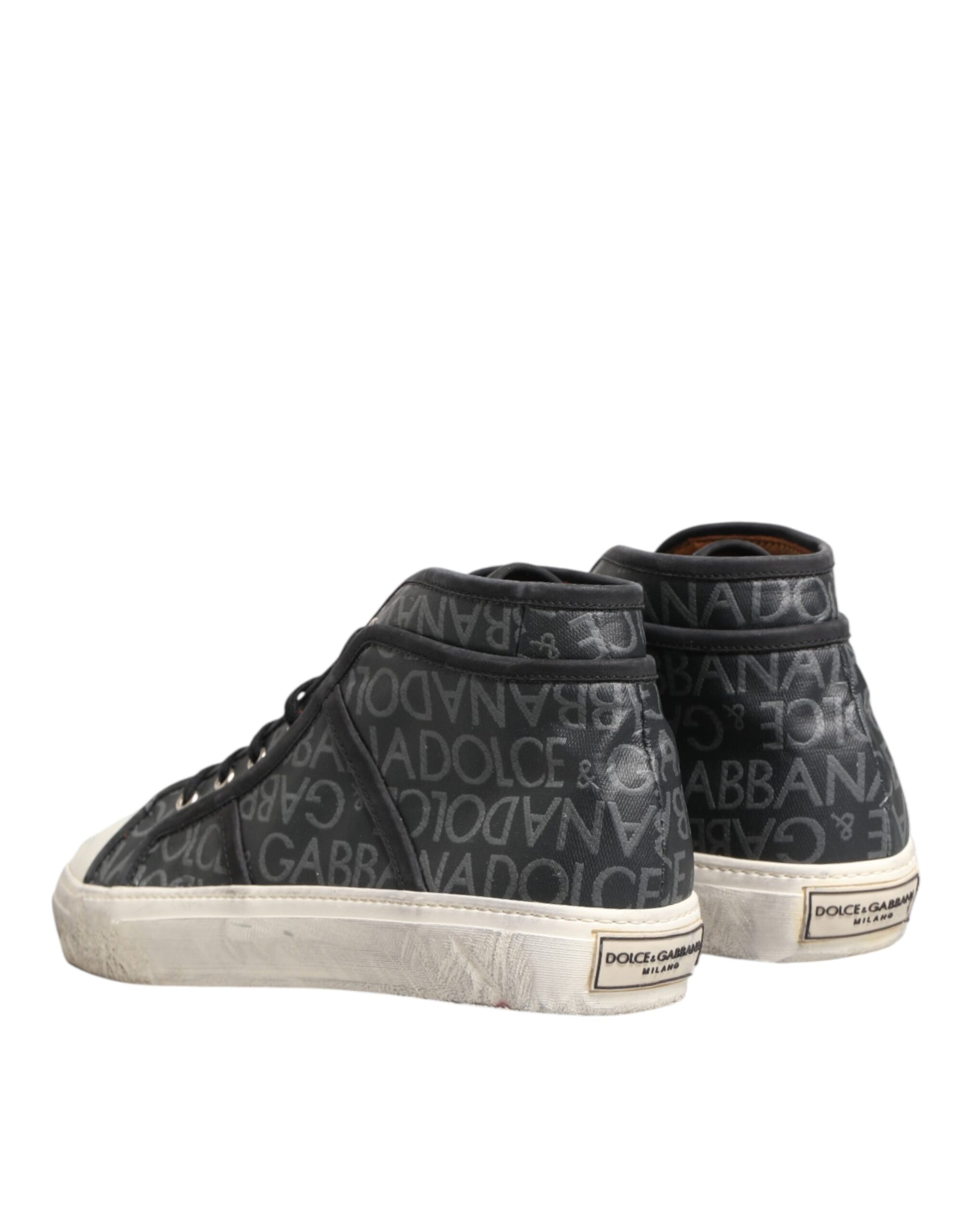 Pair of black sneakers with white soles
