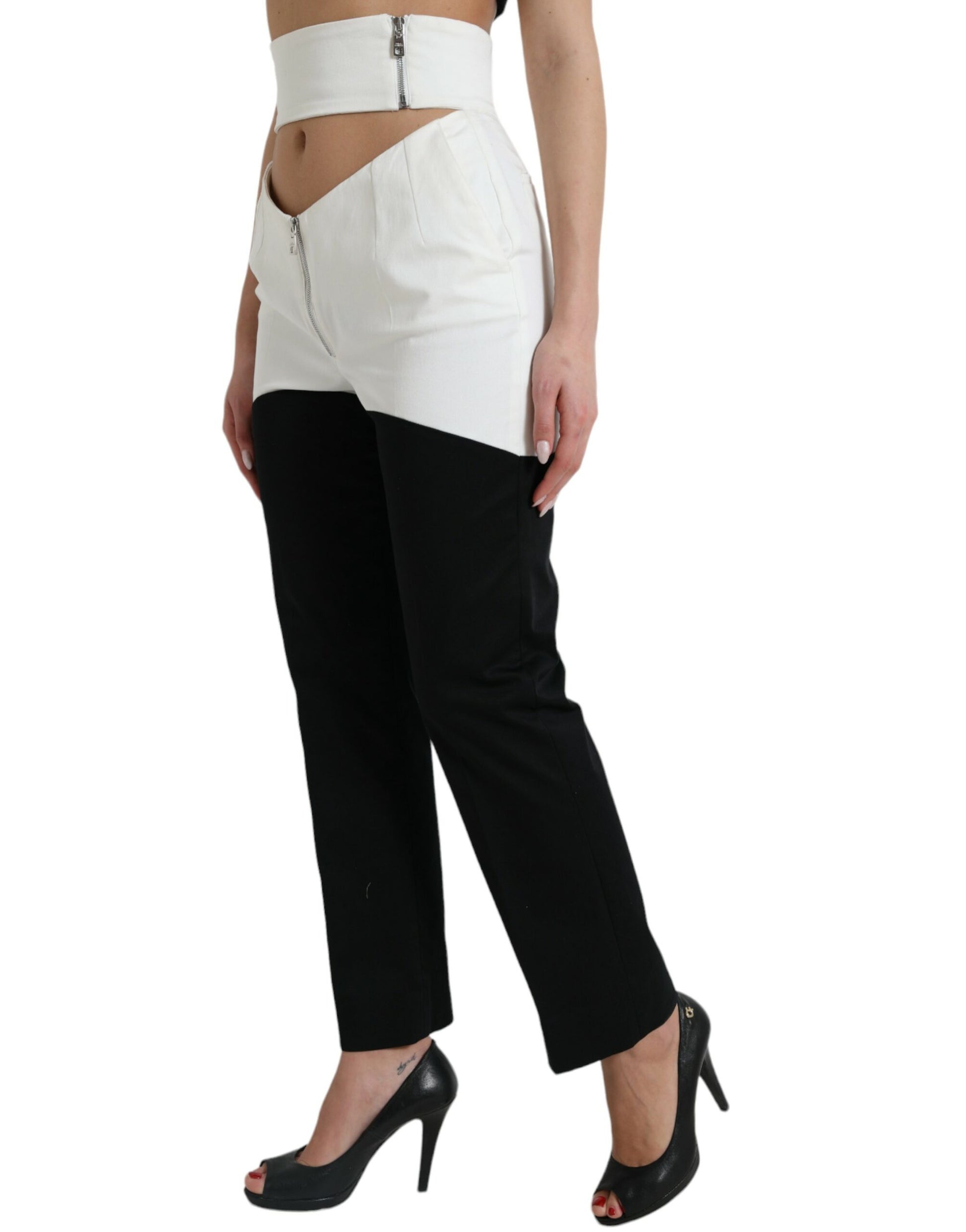 Woman wearing high waisted pants and black heels