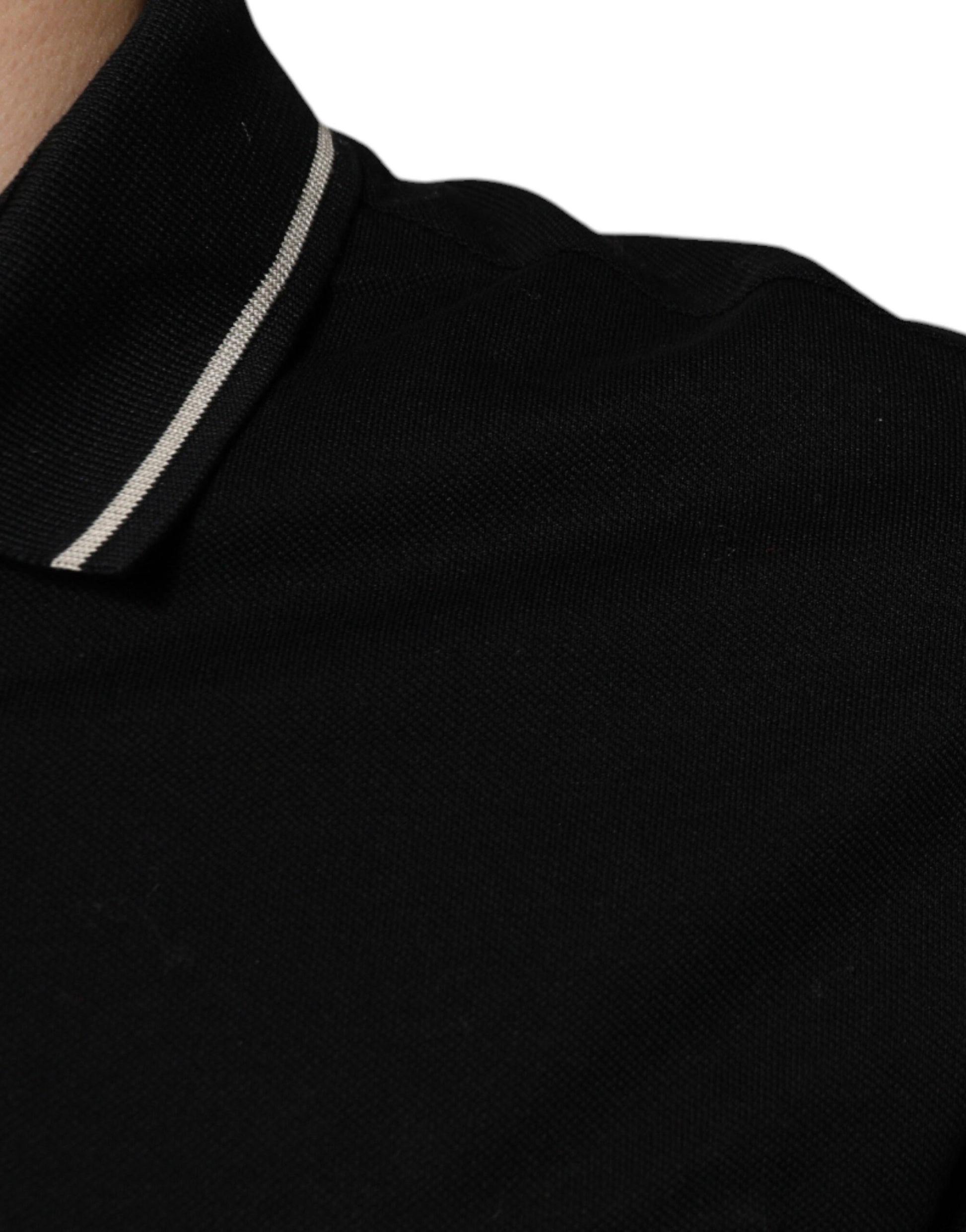 Black collared shirt with a zipper on the neckline