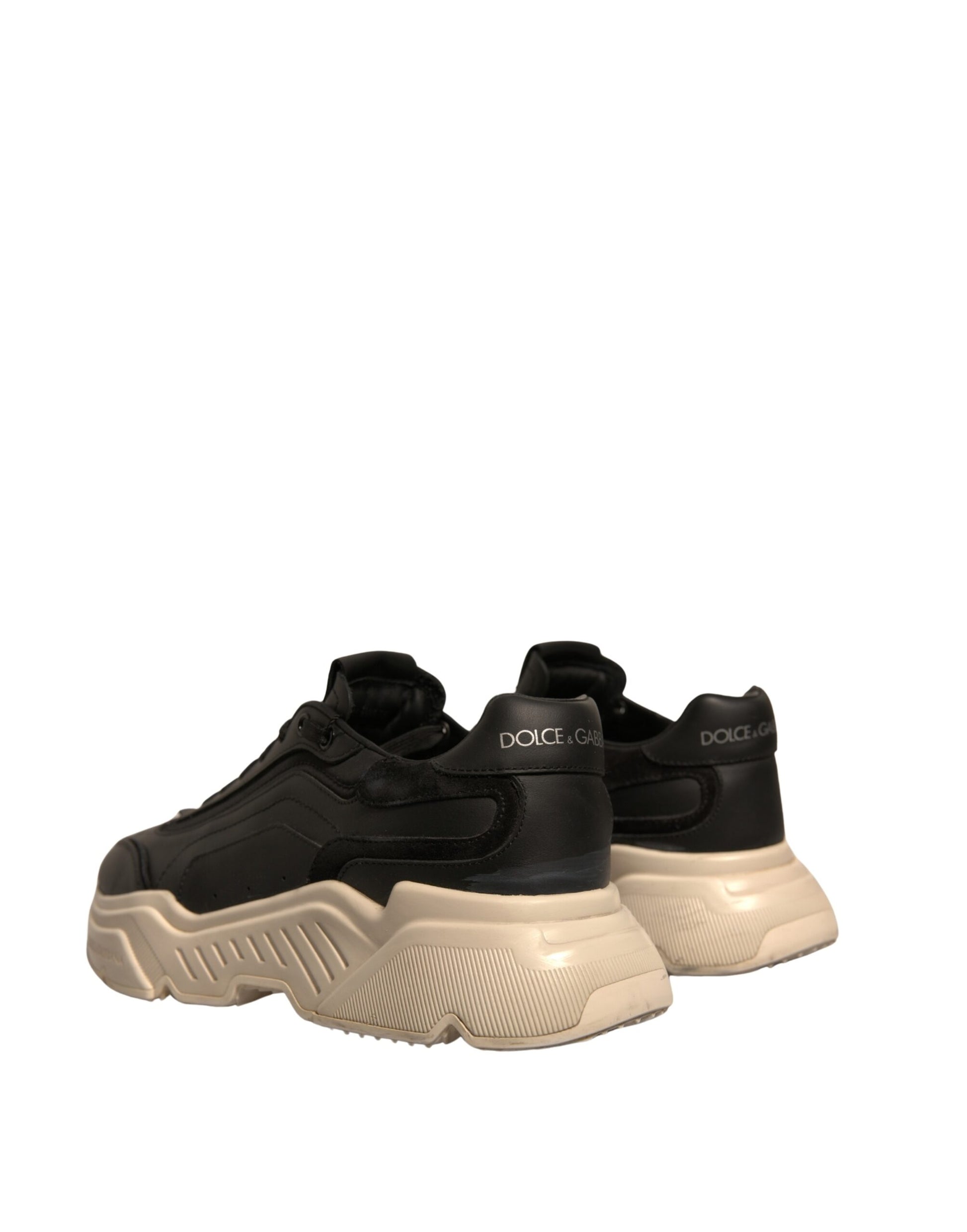 Pair of black and white sneakers with laces