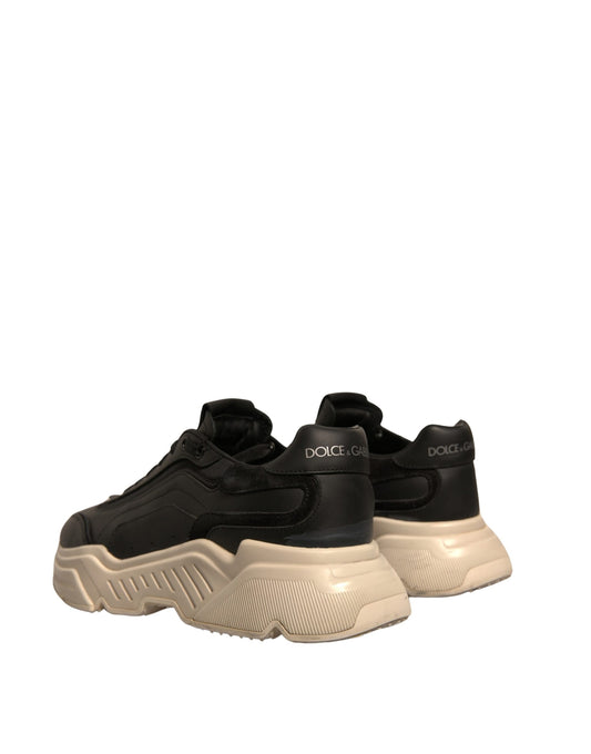 Pair of black and white sneakers with laces