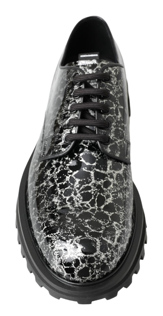 Black shoe with a patterned design on the upper and sole