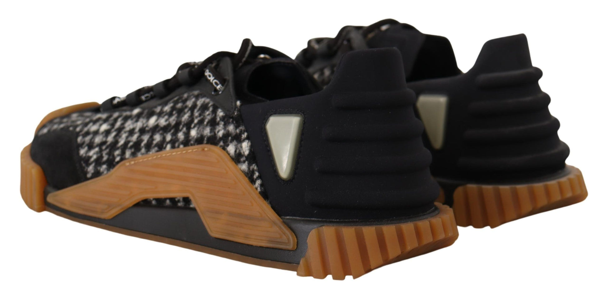 Pair of black and white sneakers with orange accents