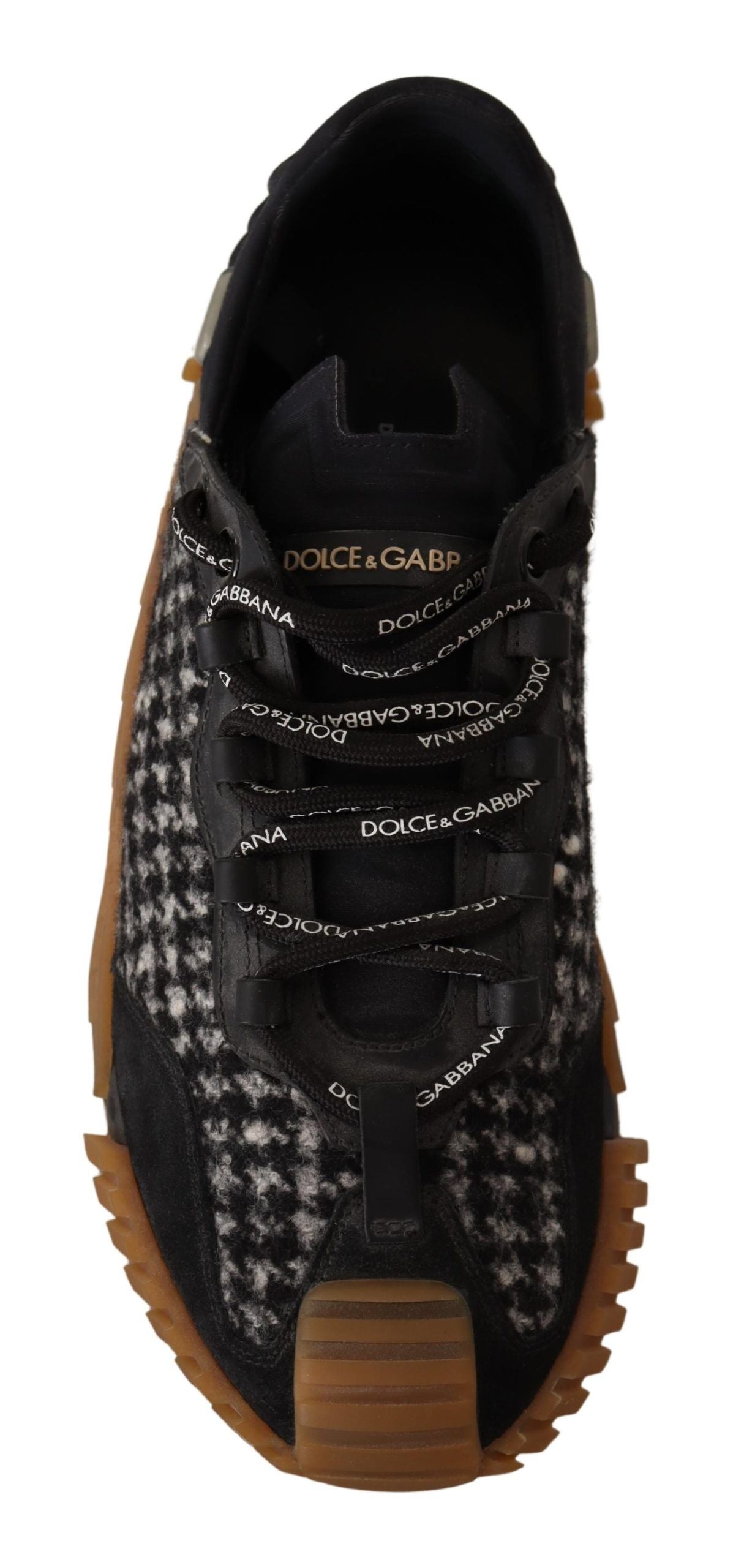 Black and brown shoe with laces and a patterned sole