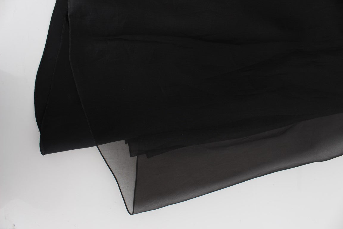 Black fabric hanging on a white surface