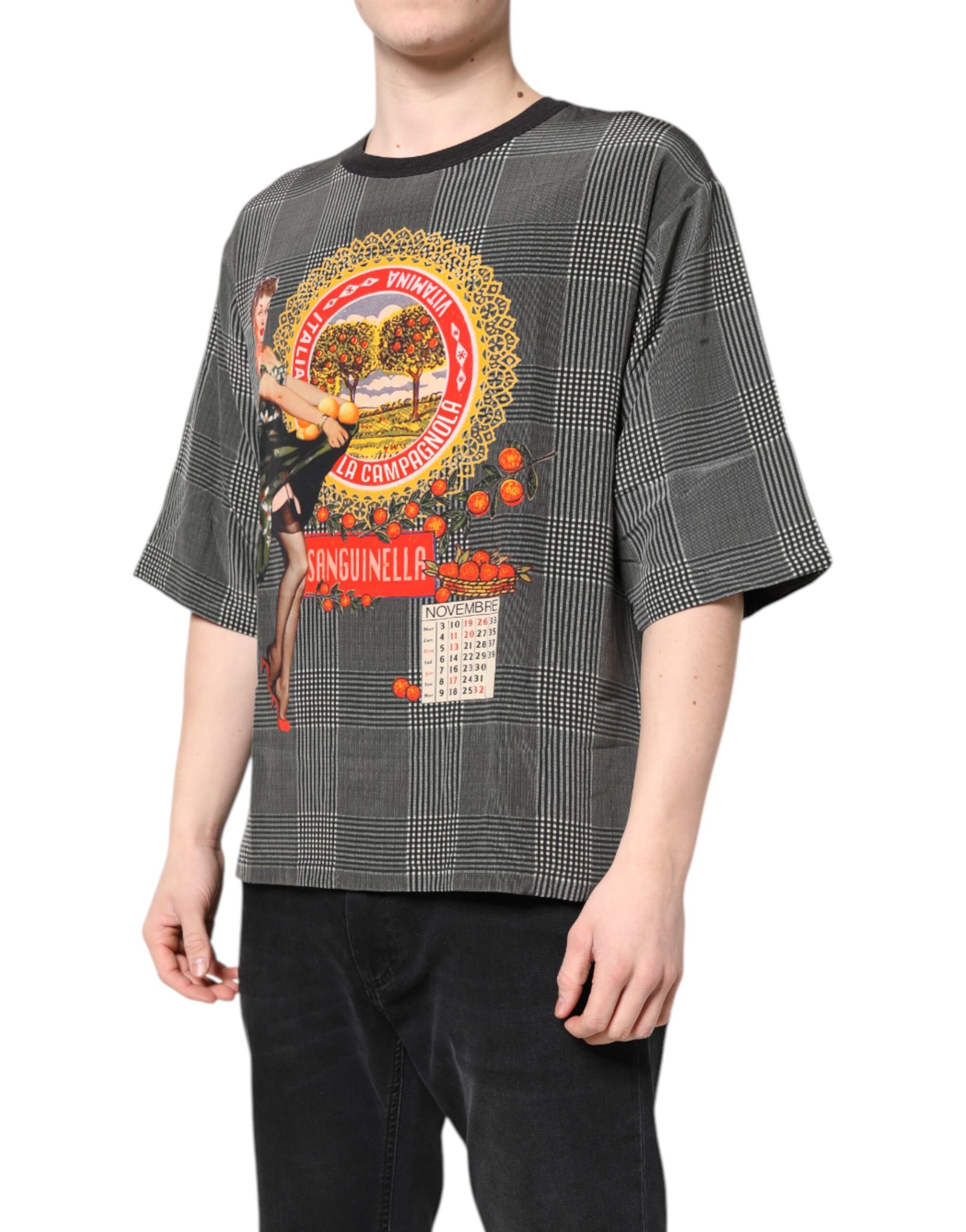 Man wearing a graphic t-shirt with a design featuring a woman on a surfboard