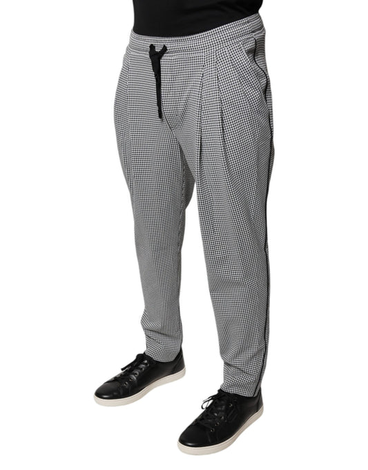 Man wearing checkered pants and black shoes