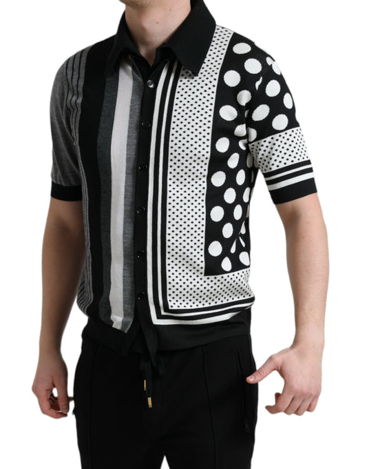 Man wearing a polka dot sweater vest over a striped shirt