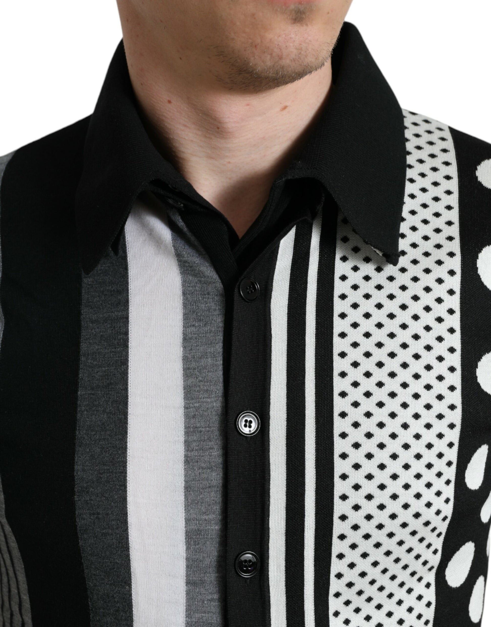 Man wearing striped shirt with black collar and buttons