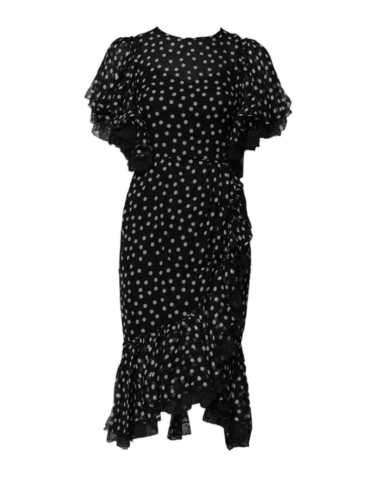 A black chiffon dress with white polka dots and lace detailing