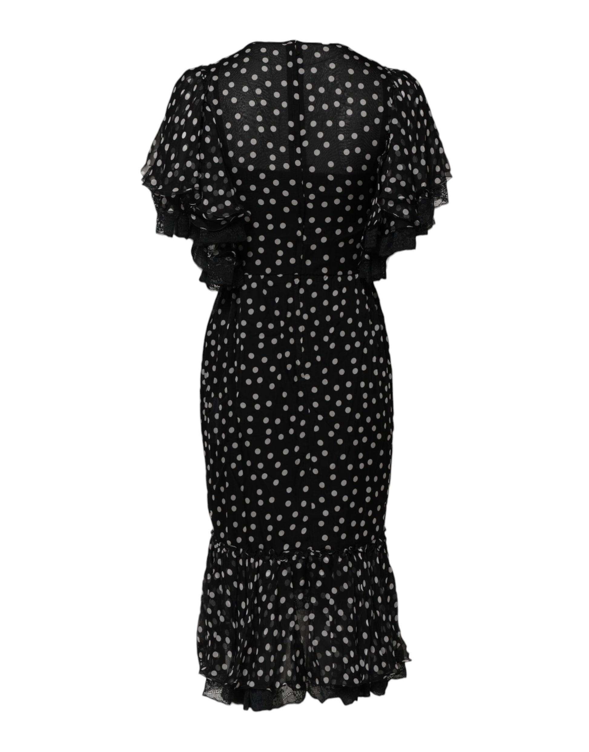 A black chiffon dress with white polka dots and ruffled sleeves