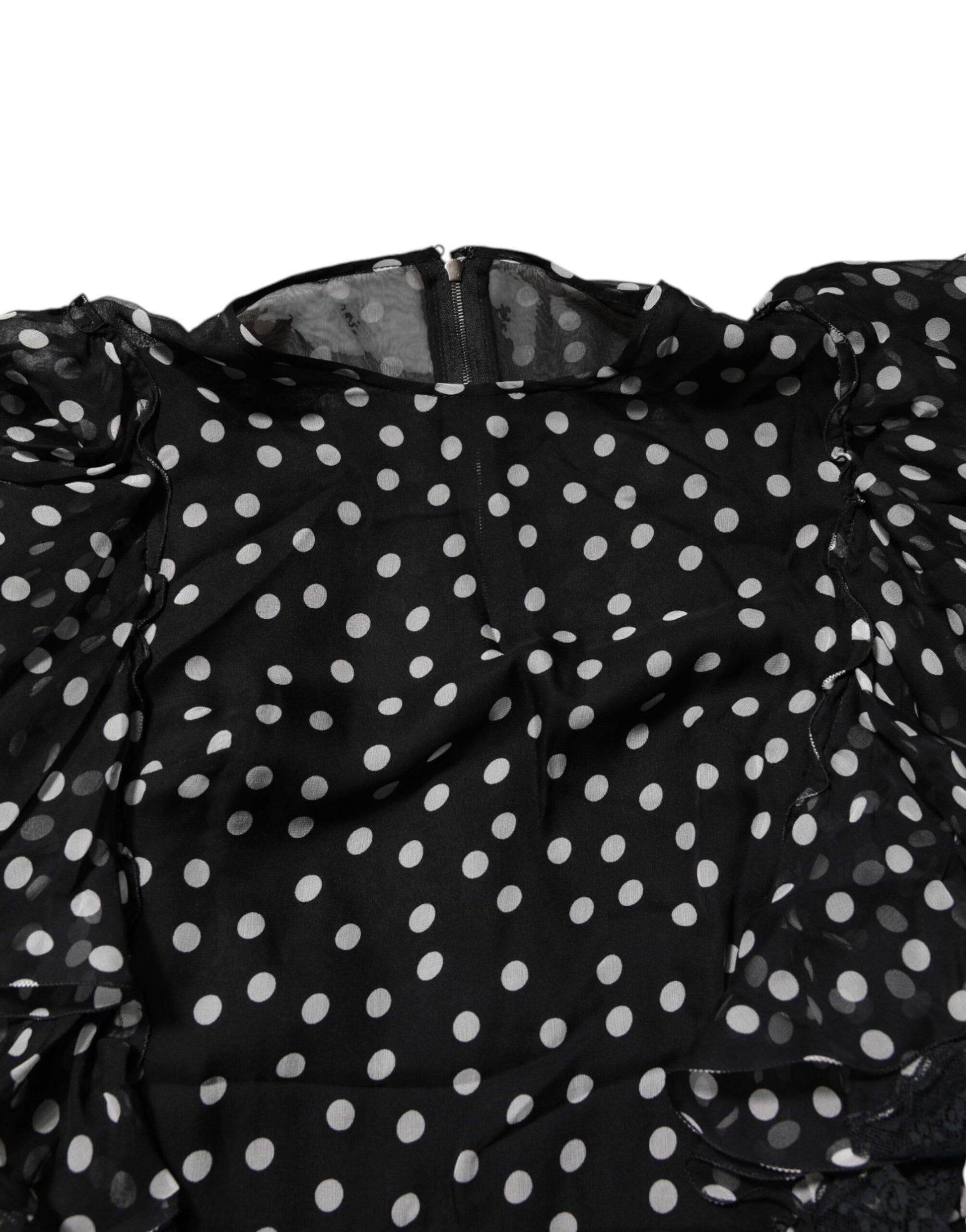 A black dress with white polka dots and chiffon ruffles
