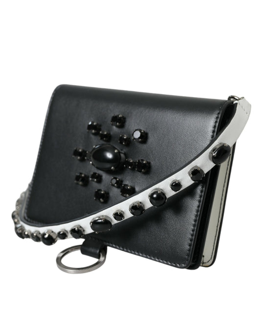 Black leather purse with silver zipper and embellishments