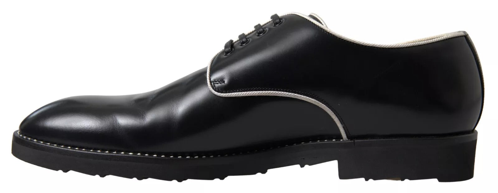 Pair of black leather dress shoes with white laces and soles, featuring a classic design