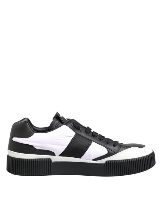 Black and white leather sneakers with laces, featuring a low top design
